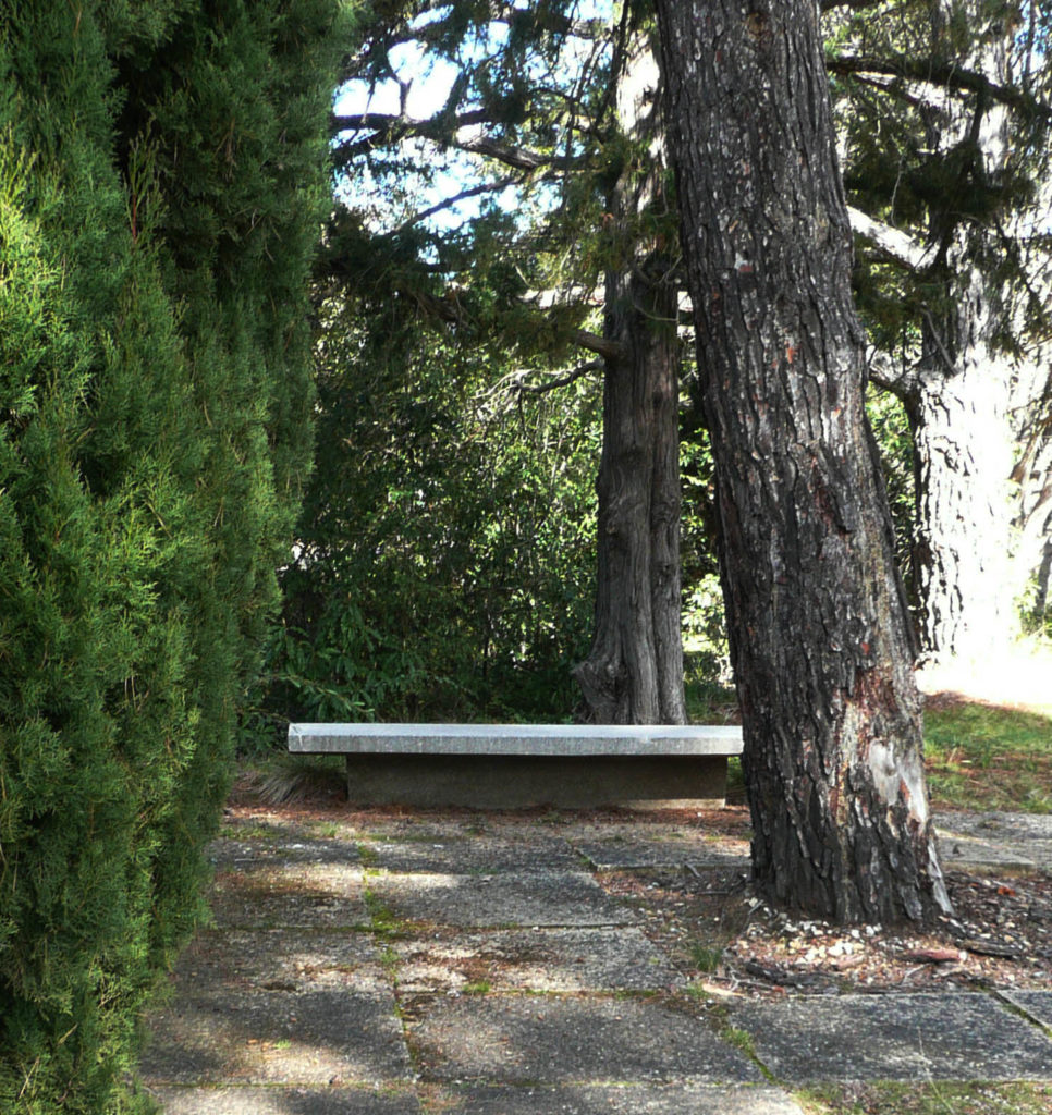 A precast concrete seat was placed at the side for contemplation, (see also Street furniture file). The grave is to the immediate right